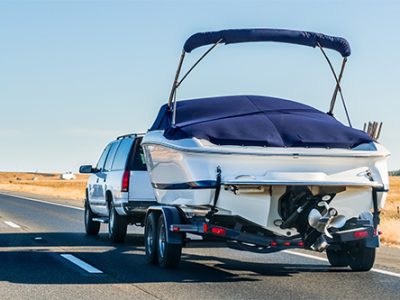 Truck towing a  boat on the interstate, California